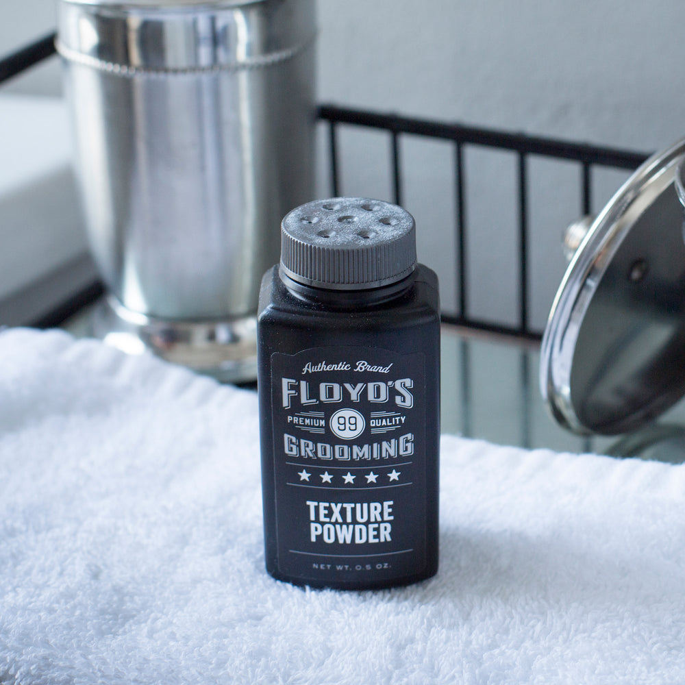 Floyd's 99 jar opened revealing powder and easy application benefit