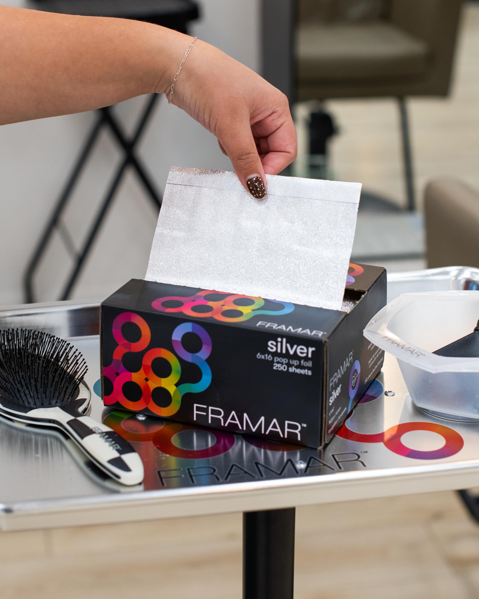 FRAMAR foil wrapped on long hair section for clean, full-length coverage