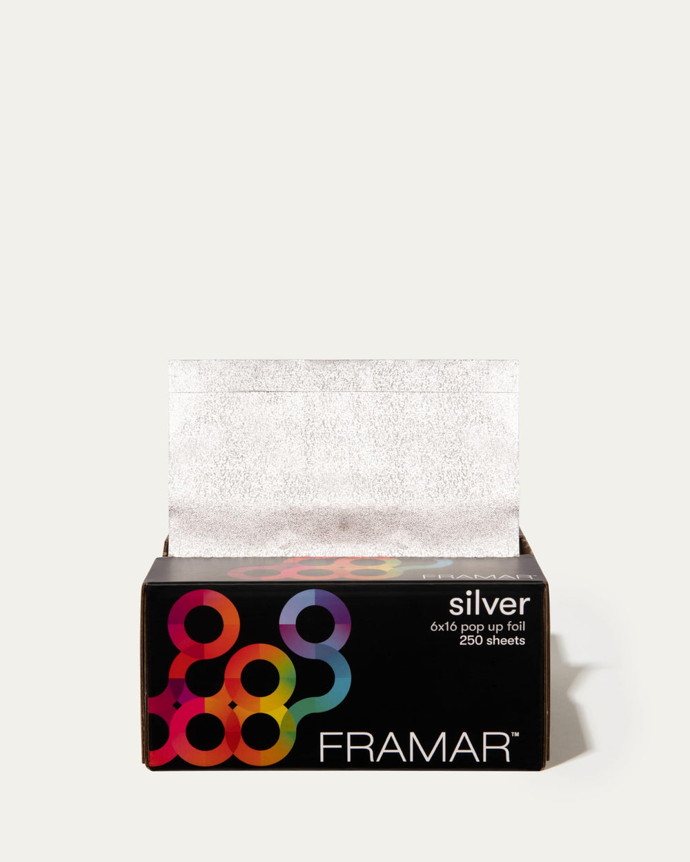FRAMAR lifestyle shot of stylist using foil for salon balayage control