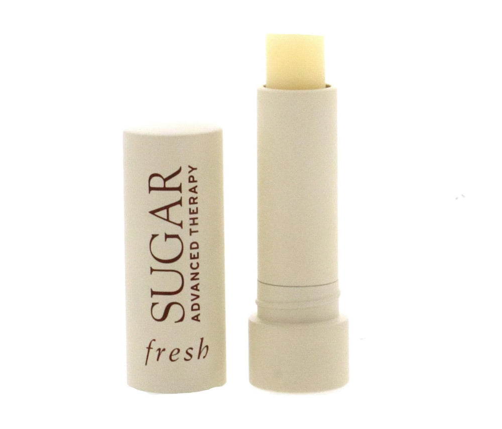 Fresh sugar lip treatment texture close-up showing glossy balm consistency and hyaluronic spheres for immediate plumping