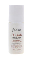 Fresh Sugar roll-on next to travel items showing compact 75ml size for portability and convenience