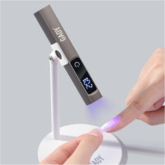 GAOY handheld lamp in hand demonstrating compact size and precise control benefit