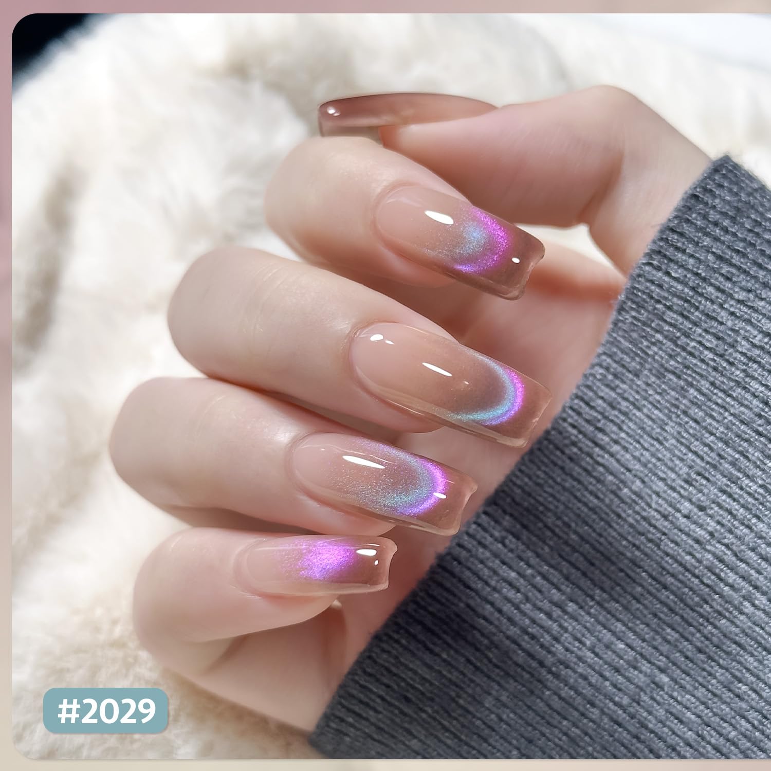GAOY swatches on nail wheel showing pink and green holographic color shifts