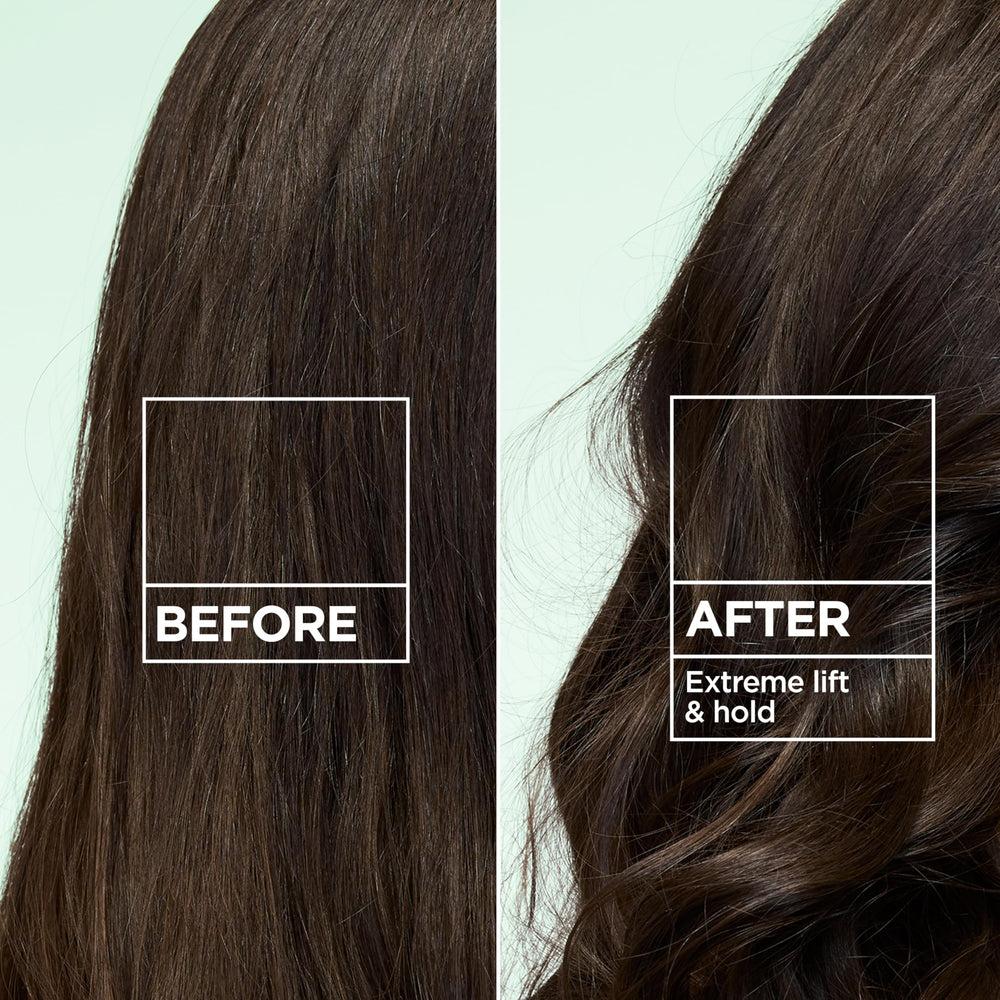 Garnier Fructis can in hand demonstrating travel-ready size benefit