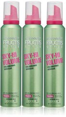 Garnier Fructis front packaging showing three cans and clear volume benefit