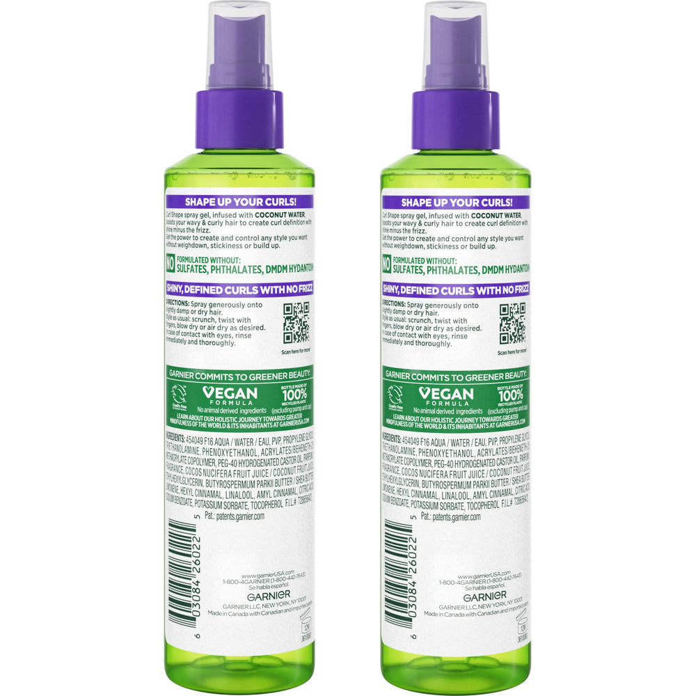 Garnier Fructis spray in hand demonstrating easy application and even coverage