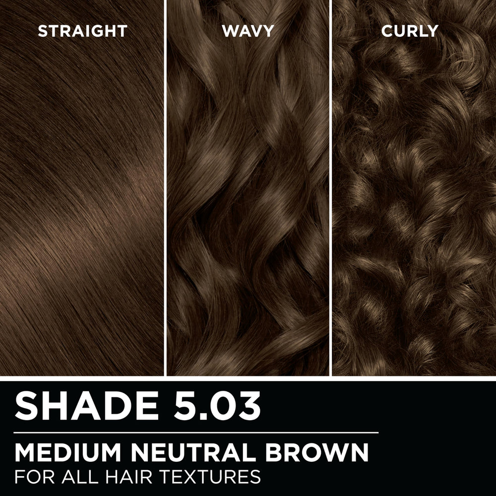 Model wearing Garnier Olia 5.03 with shiny, natural-looking medium neutral brown hair