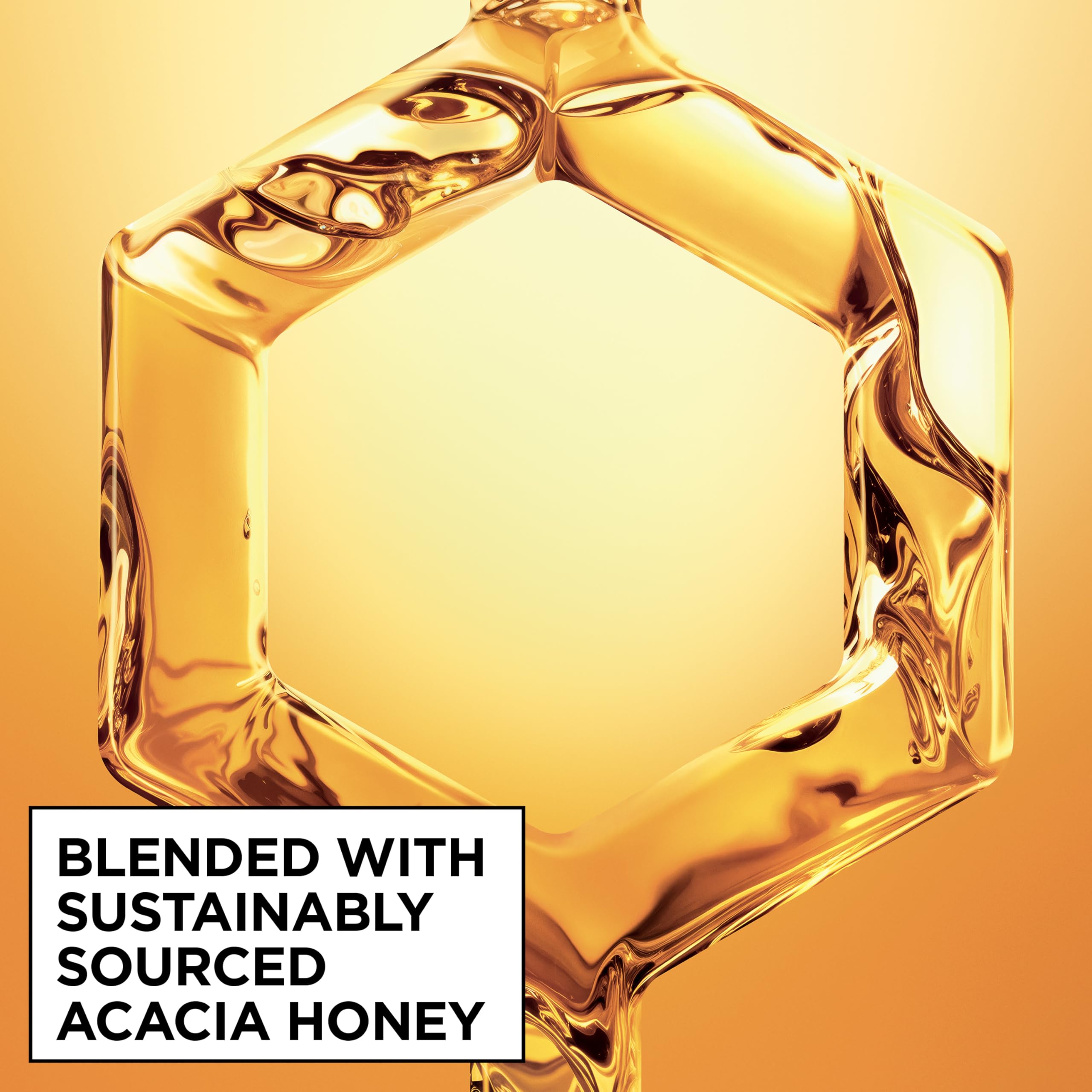 Garnier applying serum to long hair for instant smoothing benefit