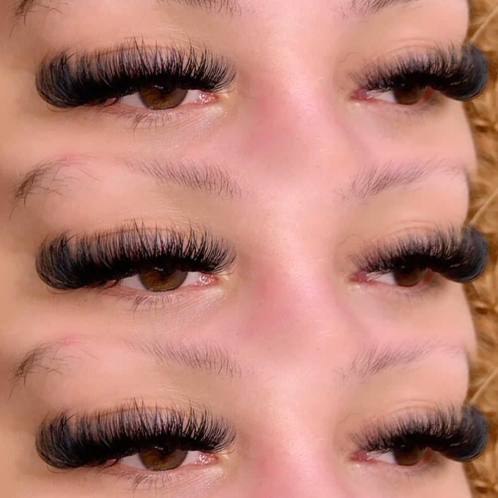 Geeneiya model applying cluster lashes demonstrating quick DIY placement benefits