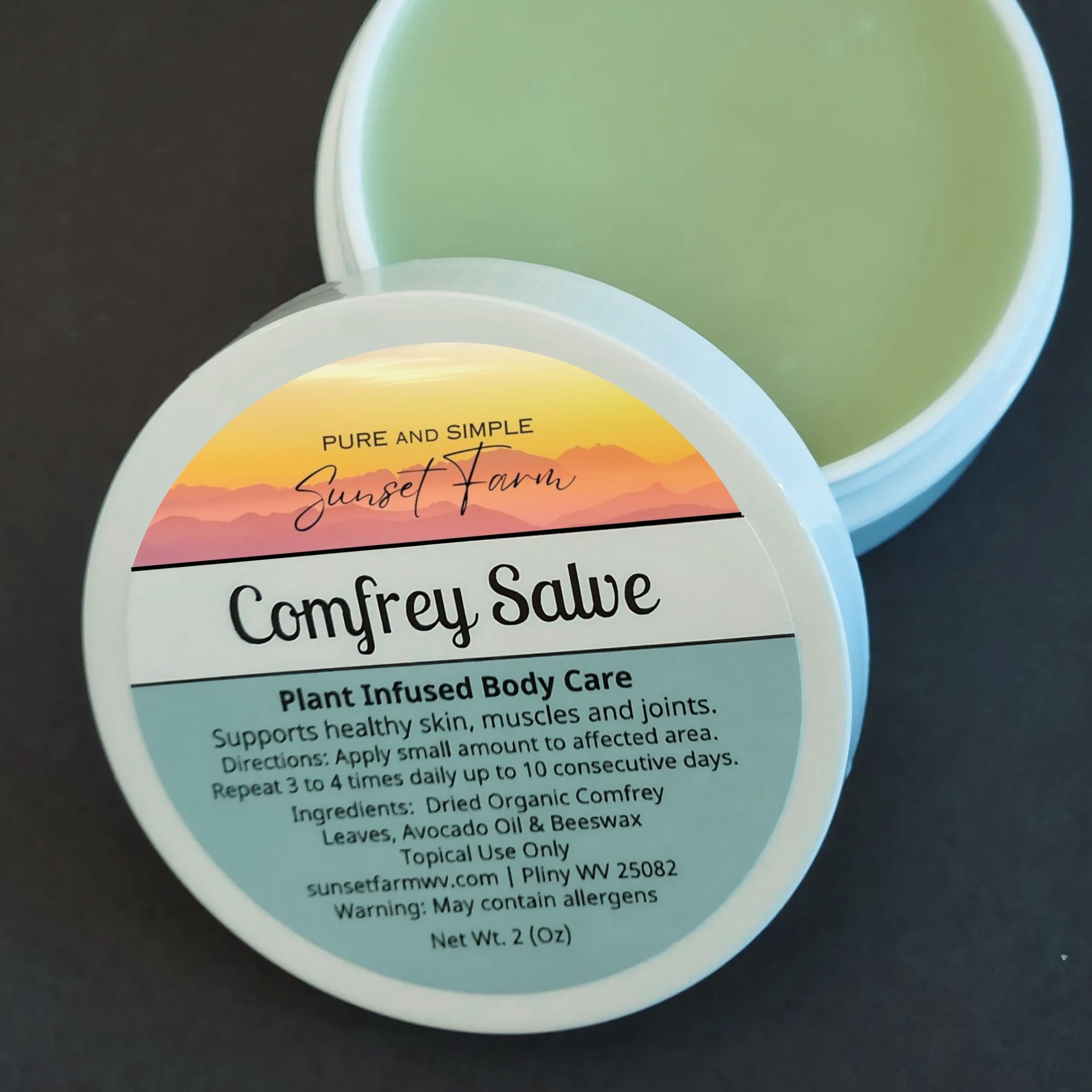 generic comfrey salve held in hand for size comparison and portable convenience
