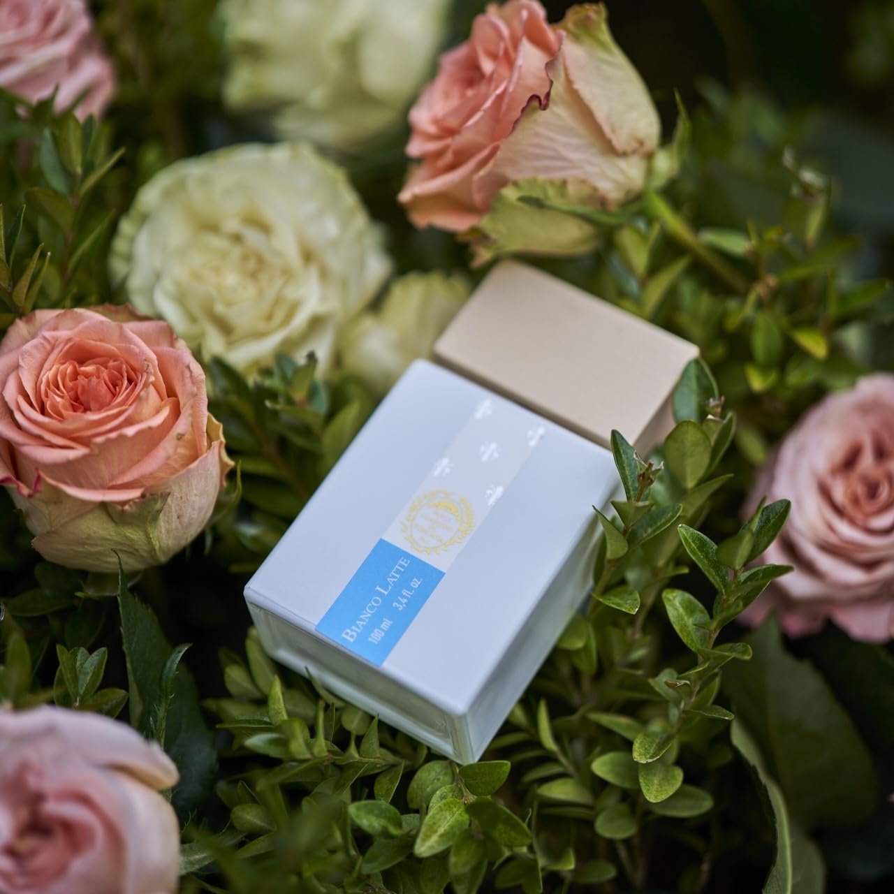 Giardini di Toscana body cream texture beside bottle to show layering benefit