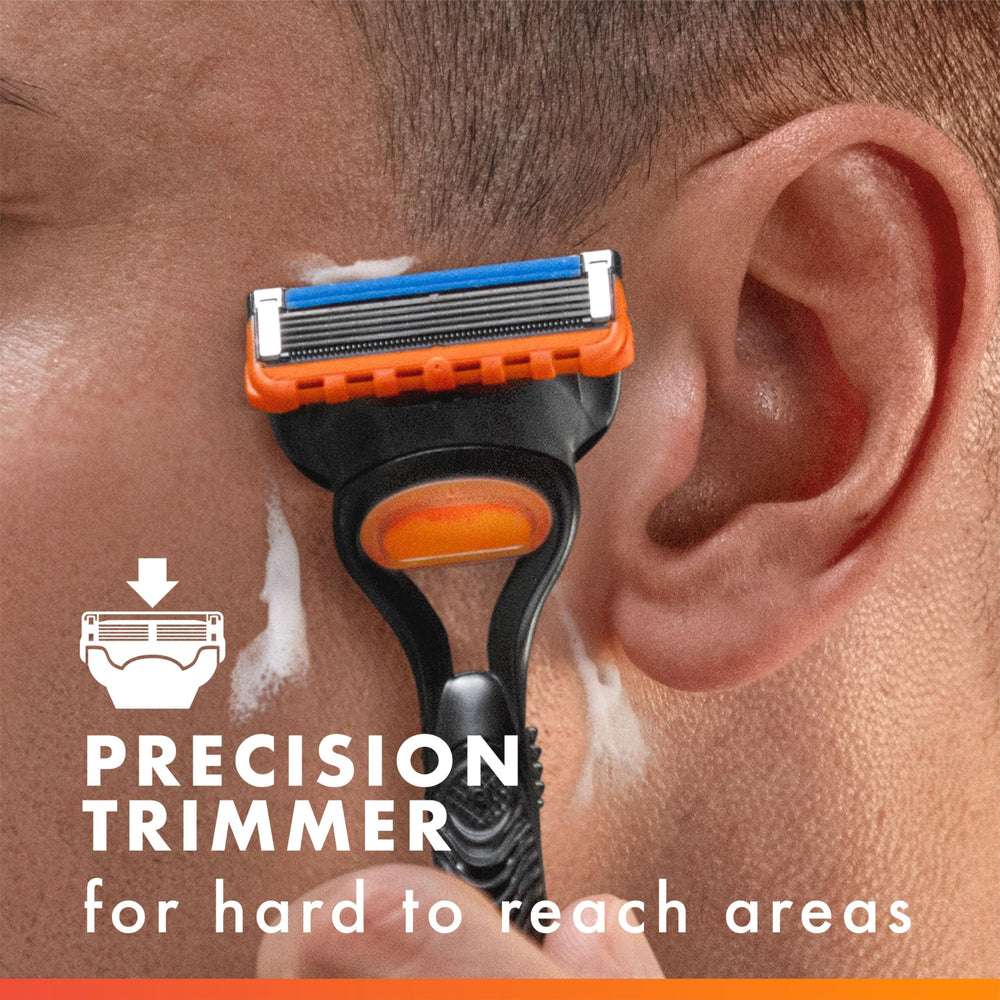 Gillette Fusion5 handle texture close-up emphasizing ergonomic grip for slippery conditions