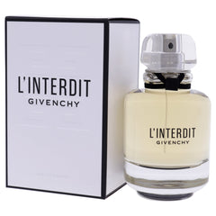 Givenchy L'Interdit beside an evening dress in lifestyle shot, suggesting elegant evening wear