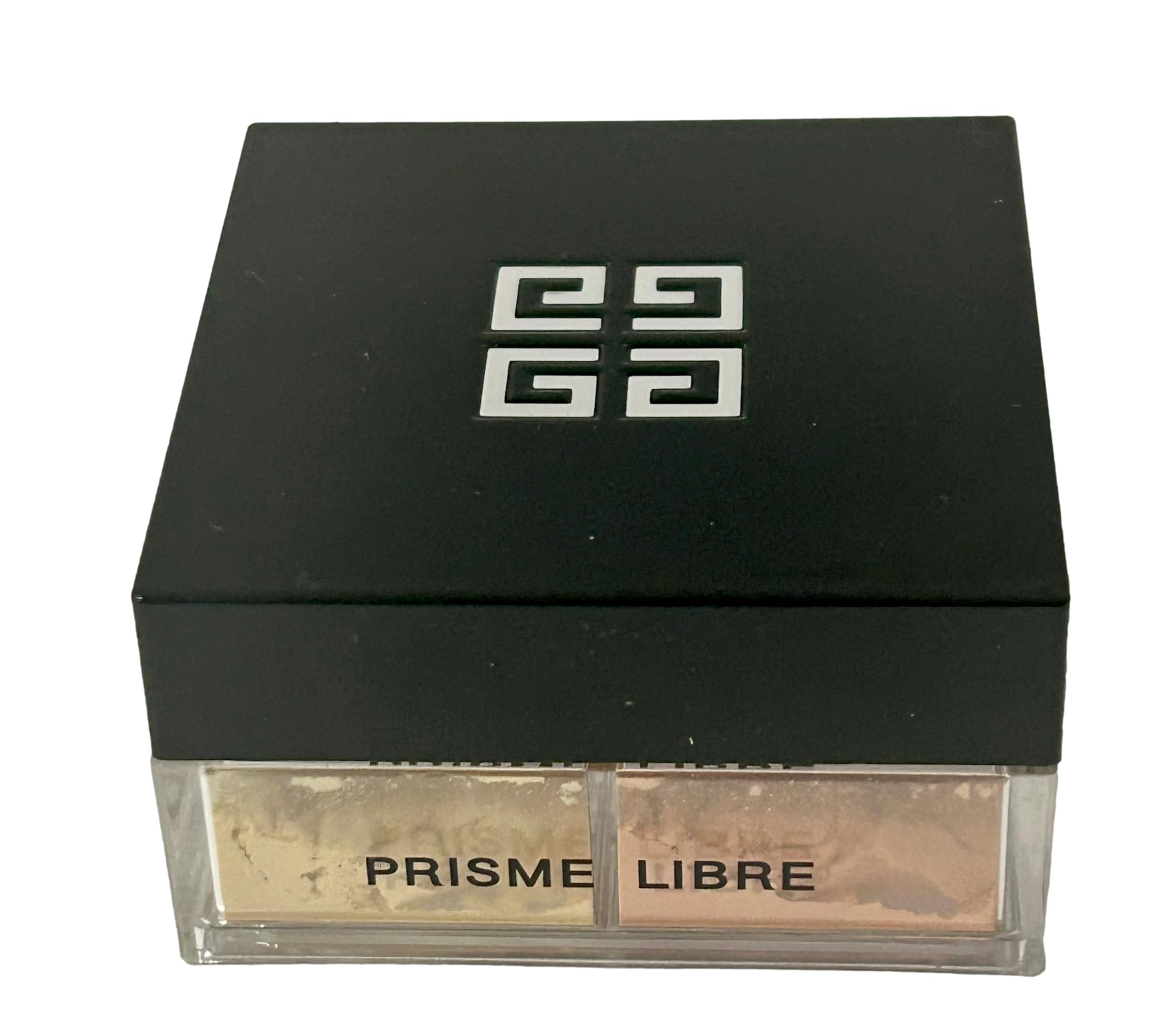 Givenchy Prisme Libre next to travel items showing convenient size for touch-ups