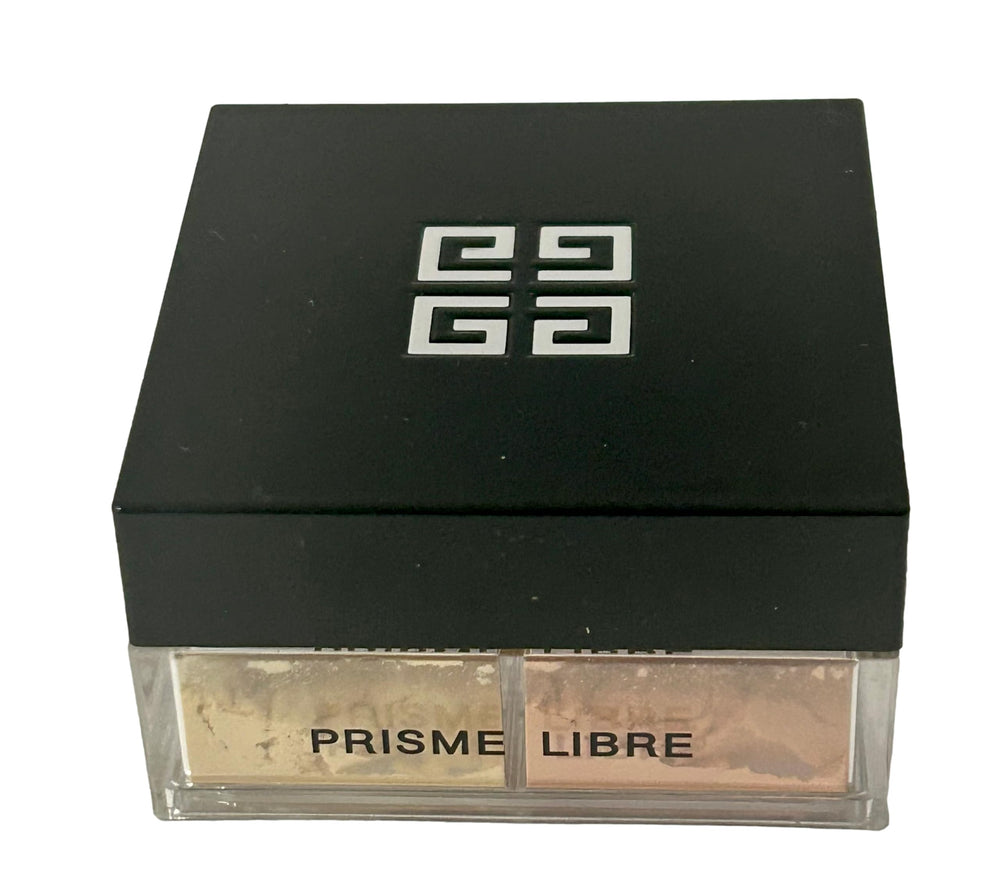 Givenchy Prisme Libre next to travel items showing convenient size for touch-ups