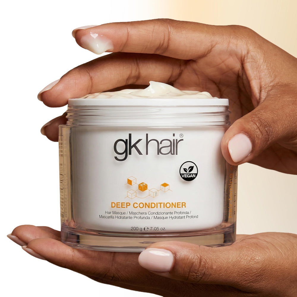 GK HAIR applying mask to wet hair for deep penetration