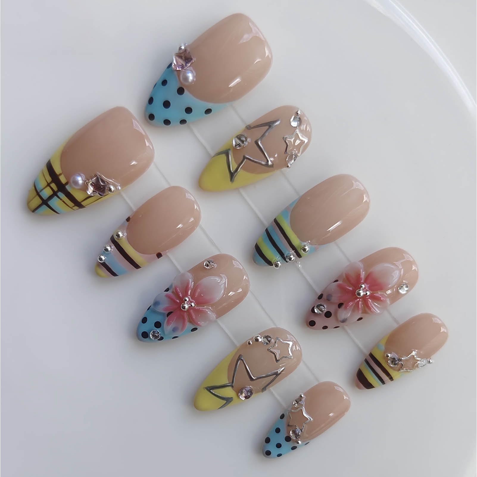 Gleamrain front view set showing colorful Y2K nail mix and bold charms