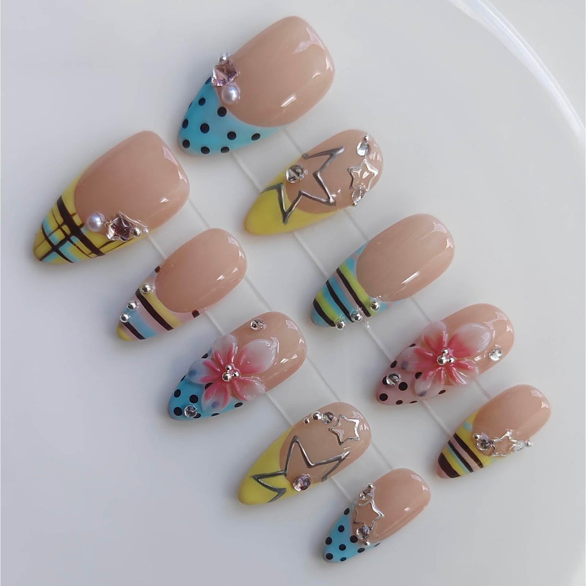 Gleamrain front view set showing colorful Y2K nail mix and bold charms