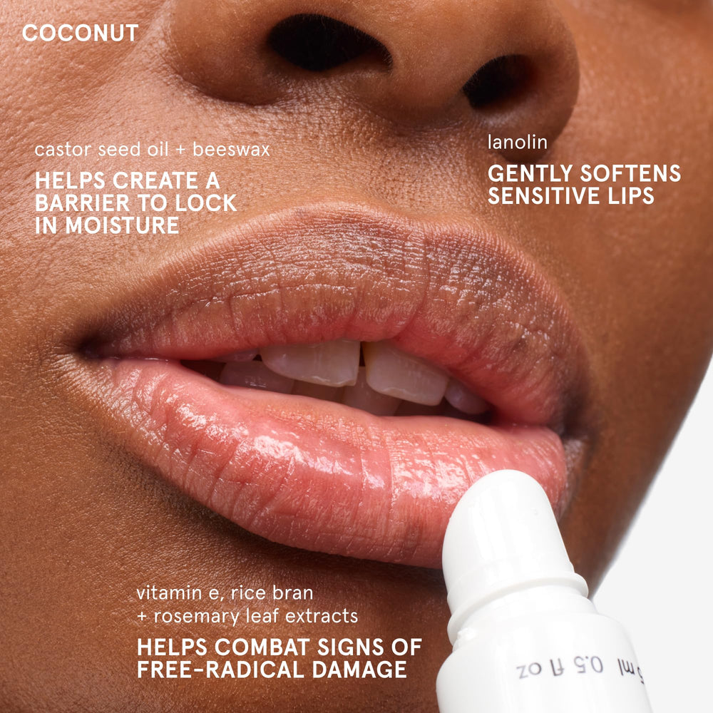 Glossier balm dotcom coconut in hand for size and portable convenience