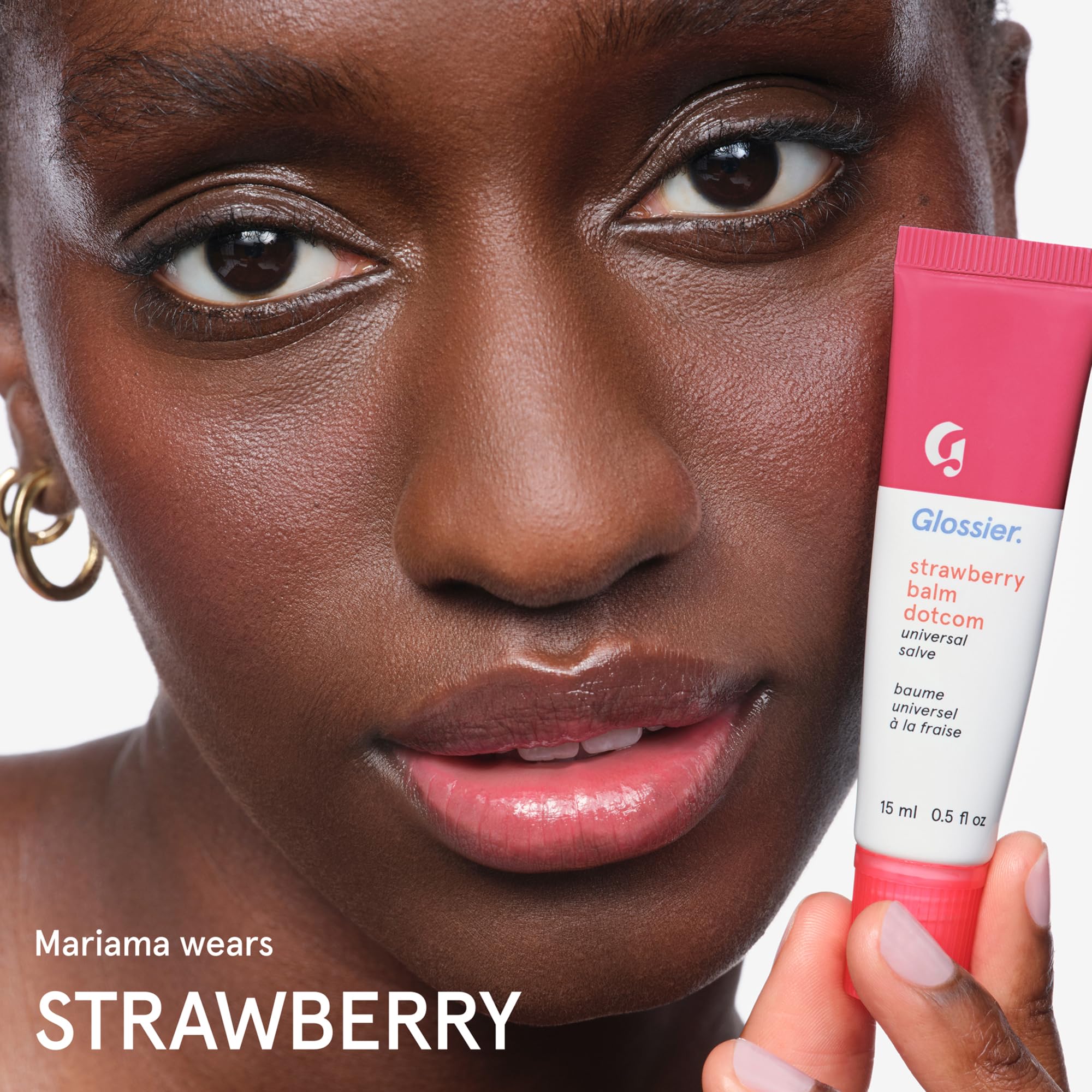 applying Glossier to cuticle to hydrate and soften nail area benefit