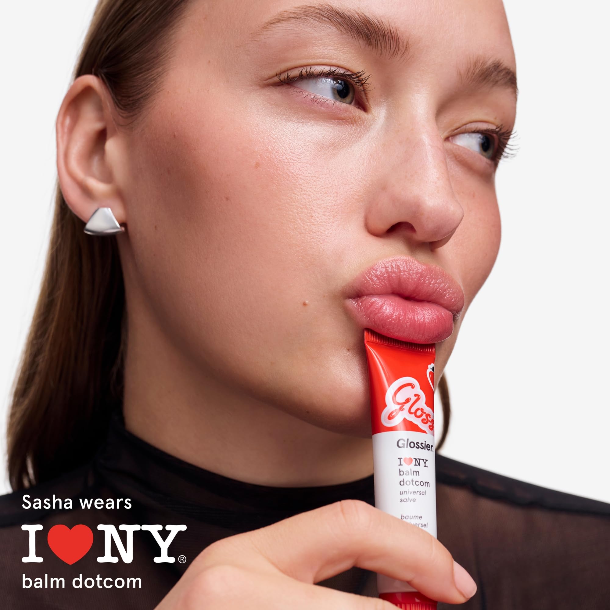 Glossier jar with fresh apples suggesting juicy apple scent and appeal