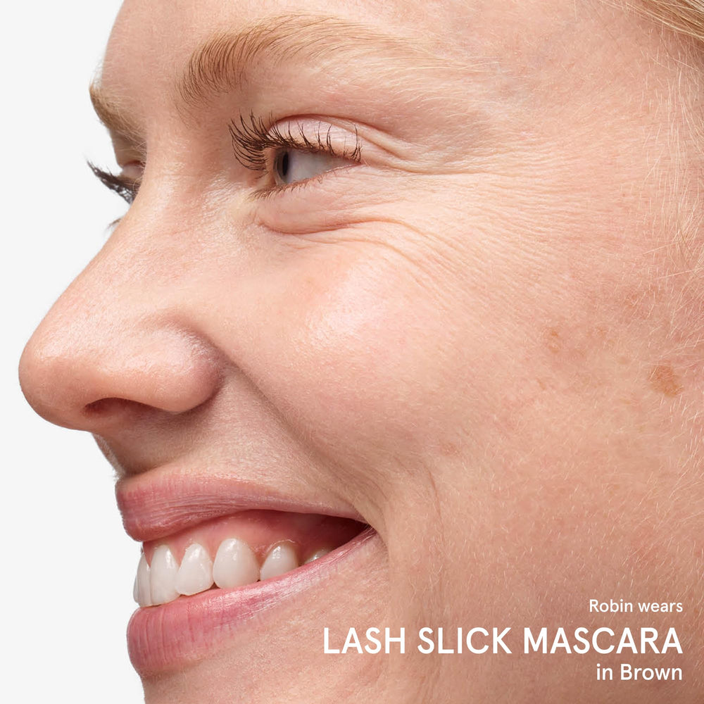 Glossier Lash Slick on bathroom shelf lifestyle image showing everyday beauty routine benefit