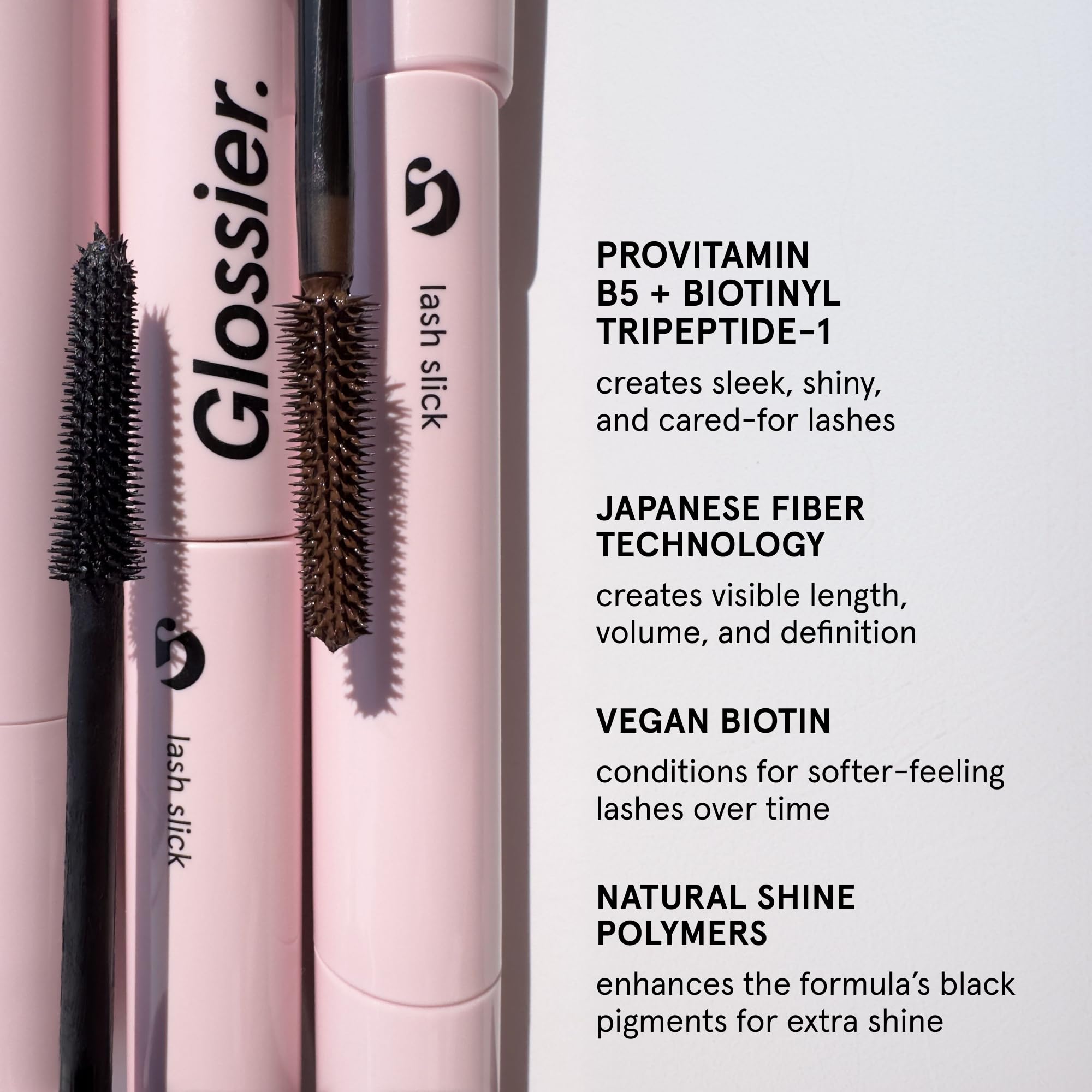 Glossier Lash Slick wand applying formula on lashes demonstrating smooth, clump-free lift