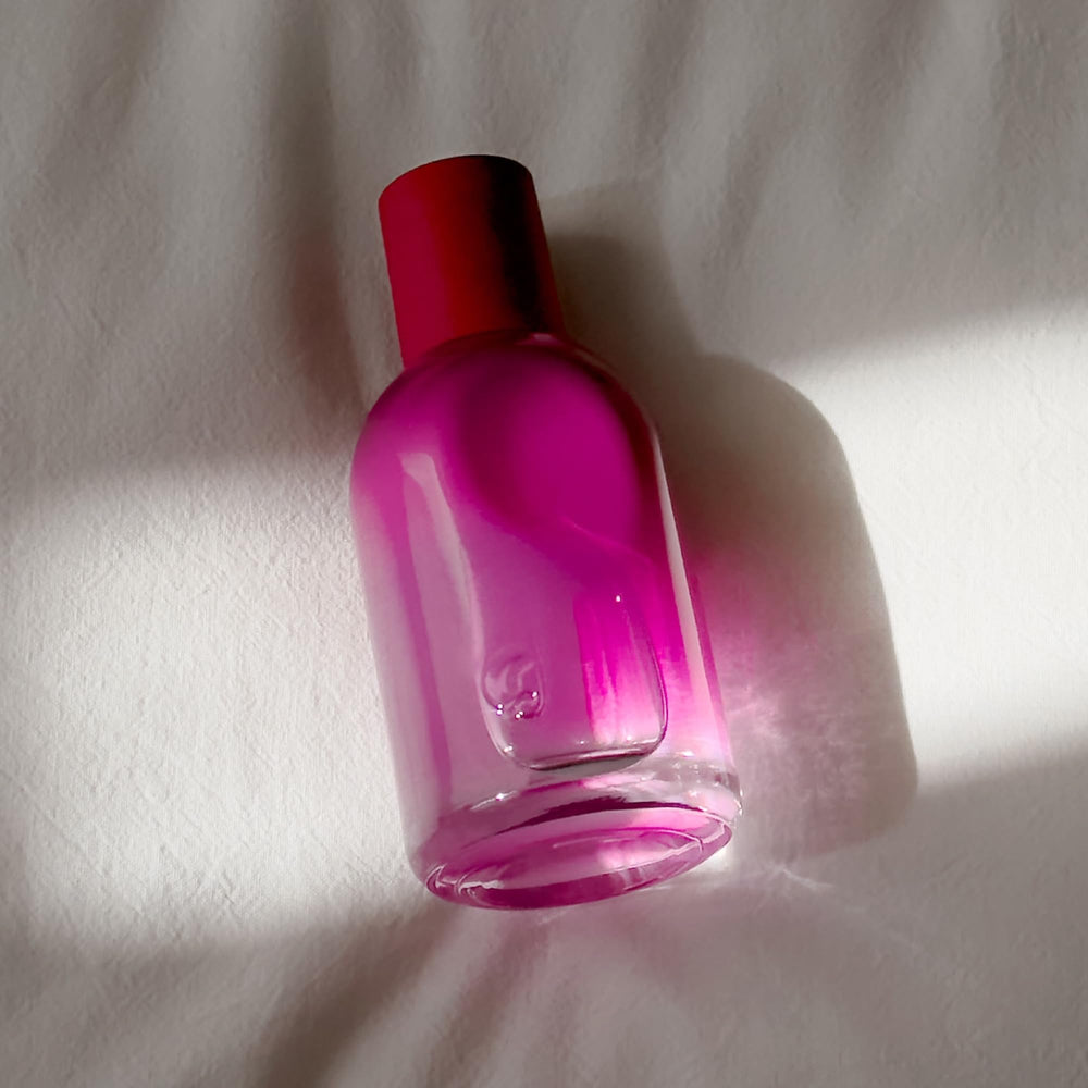 Glossier lifestyle scene with casual outfit showing subtle everyday fragrance use