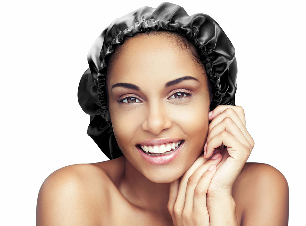Glow By Daye bonnet next to hands showing extra-large 23 inch coverage