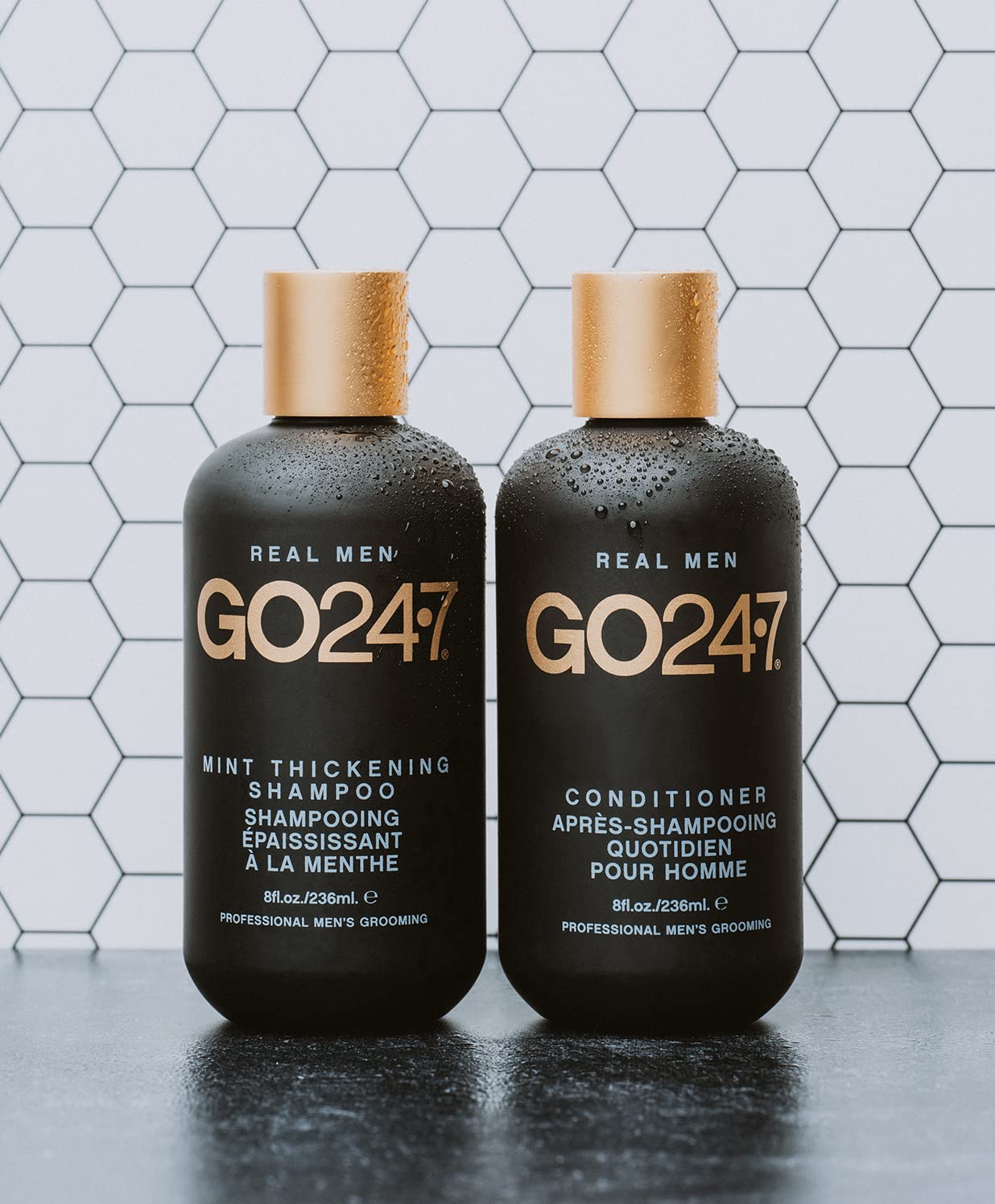 GO247 bottle beside fresh mint leaves illustrating peppermint freshness and scalp refresh