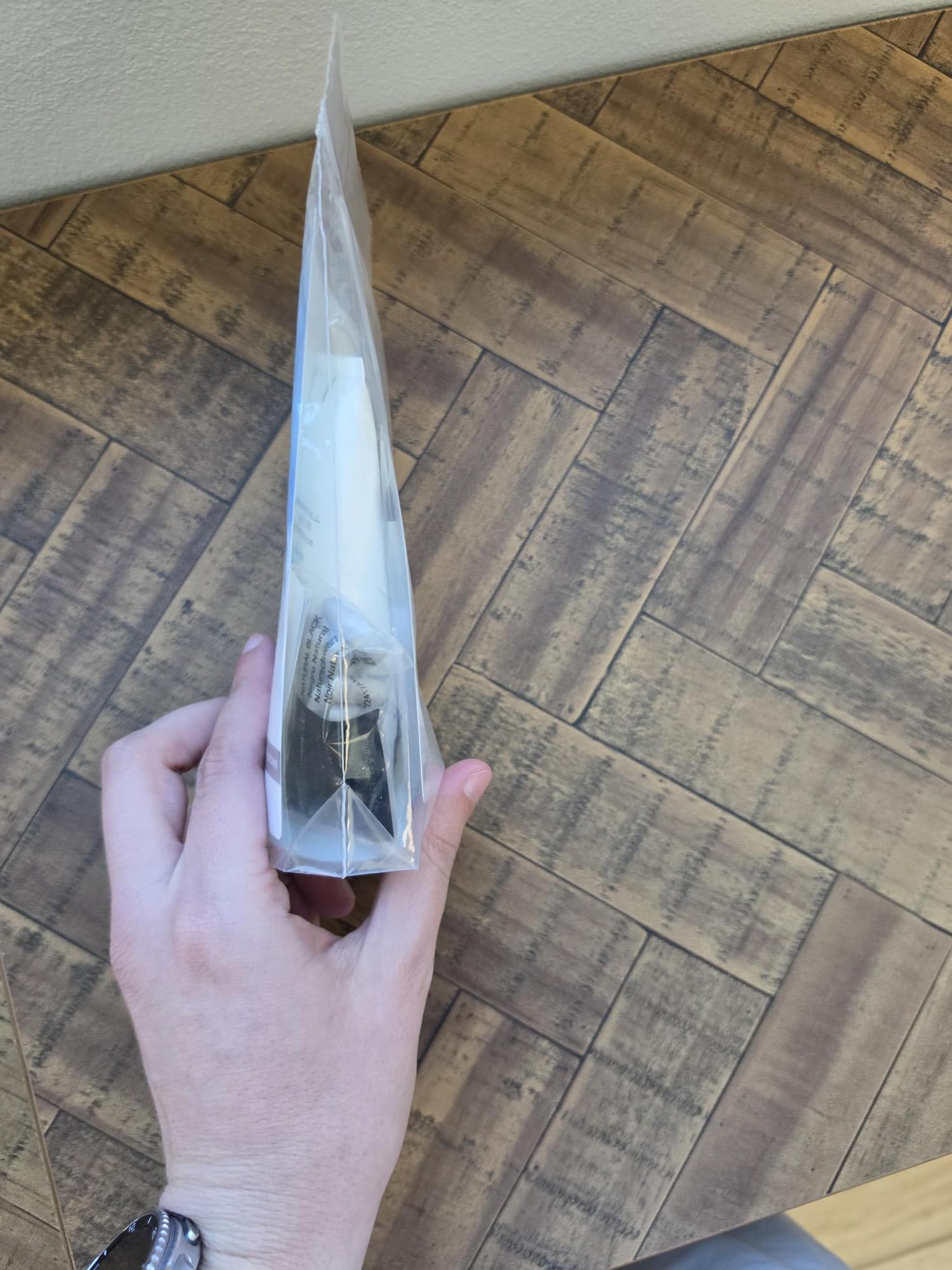 godefroy hand holding capsule for scale showing easy portioning