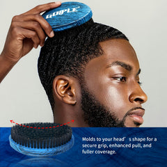 Goiple brush held in palm demonstrating ergonomic grip for stable wave brushing