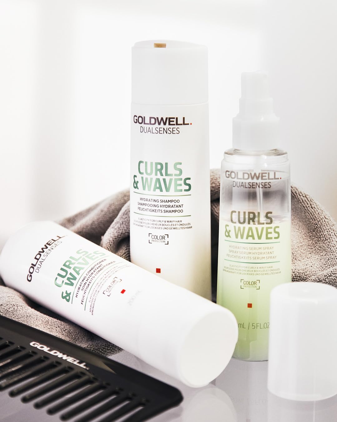 Goldwell conditioner on shelf in stylish bathroom showing salon feel
