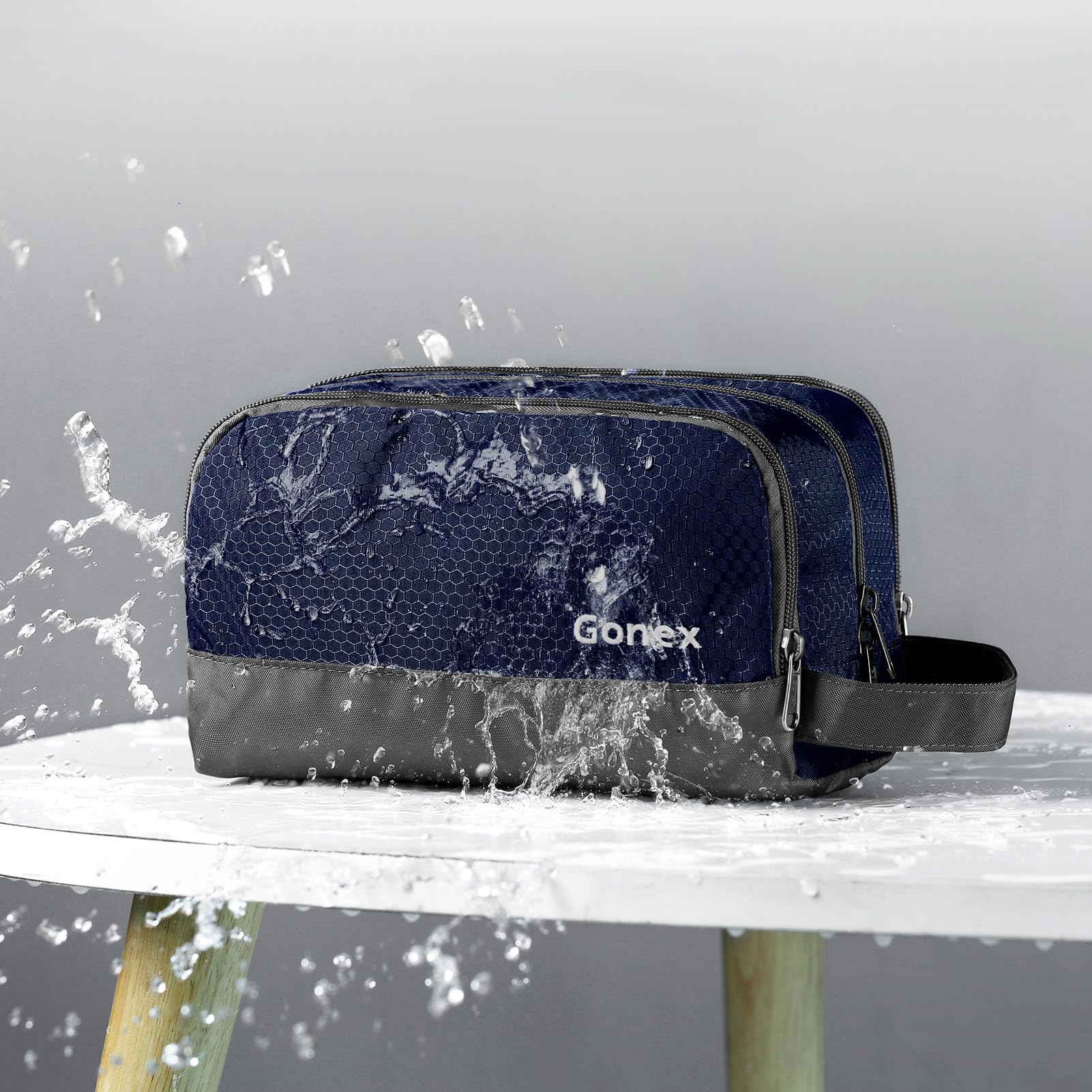 Gonex toiletry bag open revealing main compartment and zippered mesh pouch for visibility