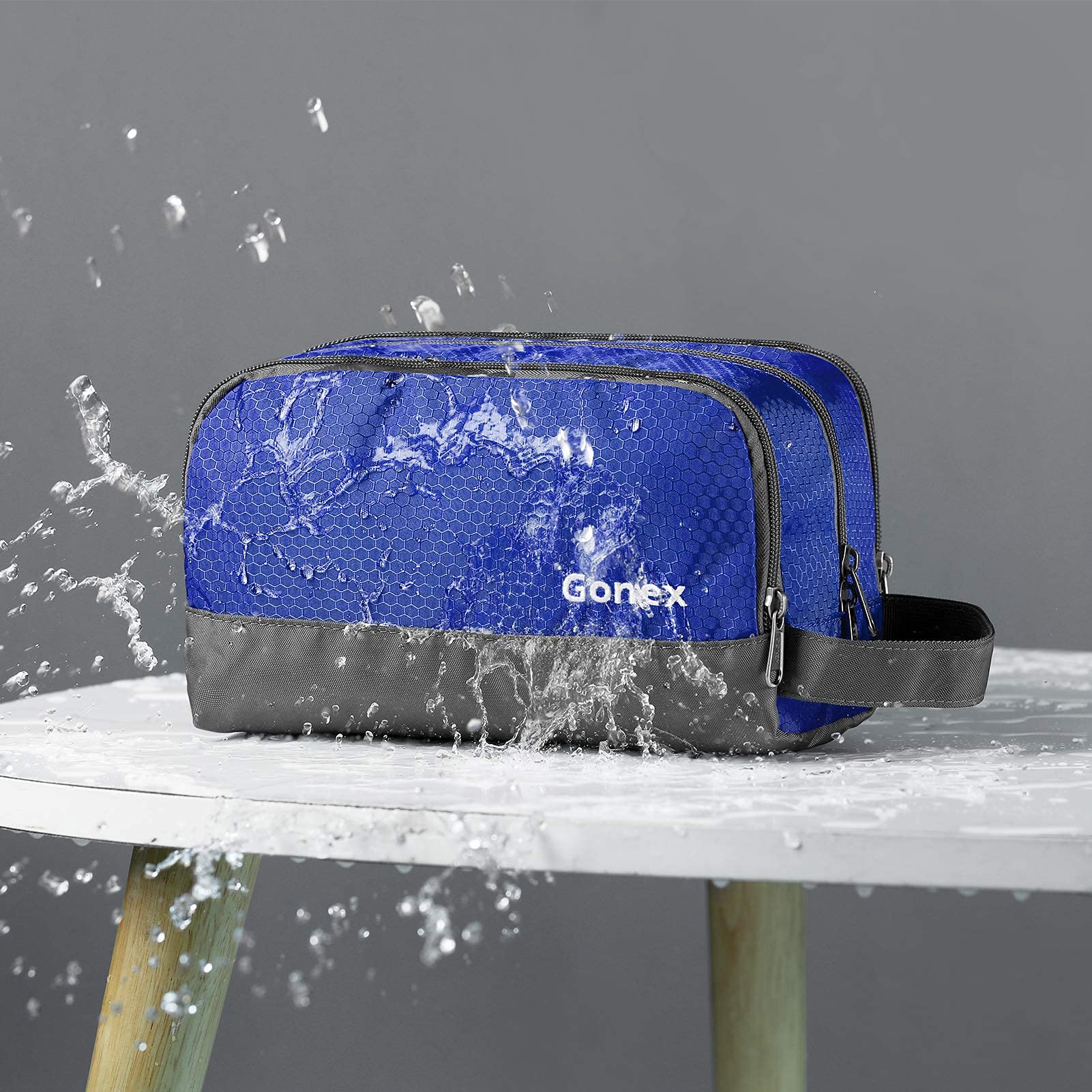 Gonex open main compartment holding bottles and grooming items for organization