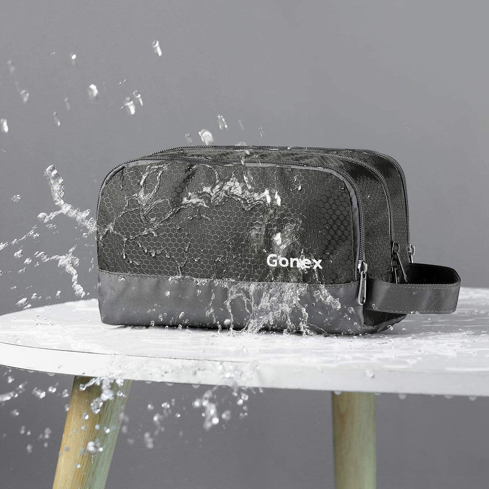 Gonex toiletry bag opened layout displaying compartments for bottles and small items