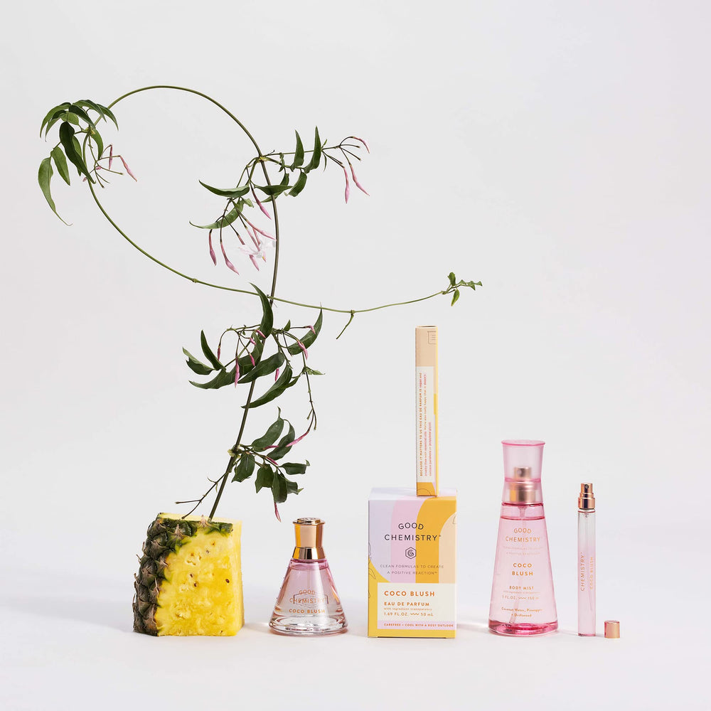 Good Chemistry bottle on a sandy beach conveying summer vibe and fresh scent