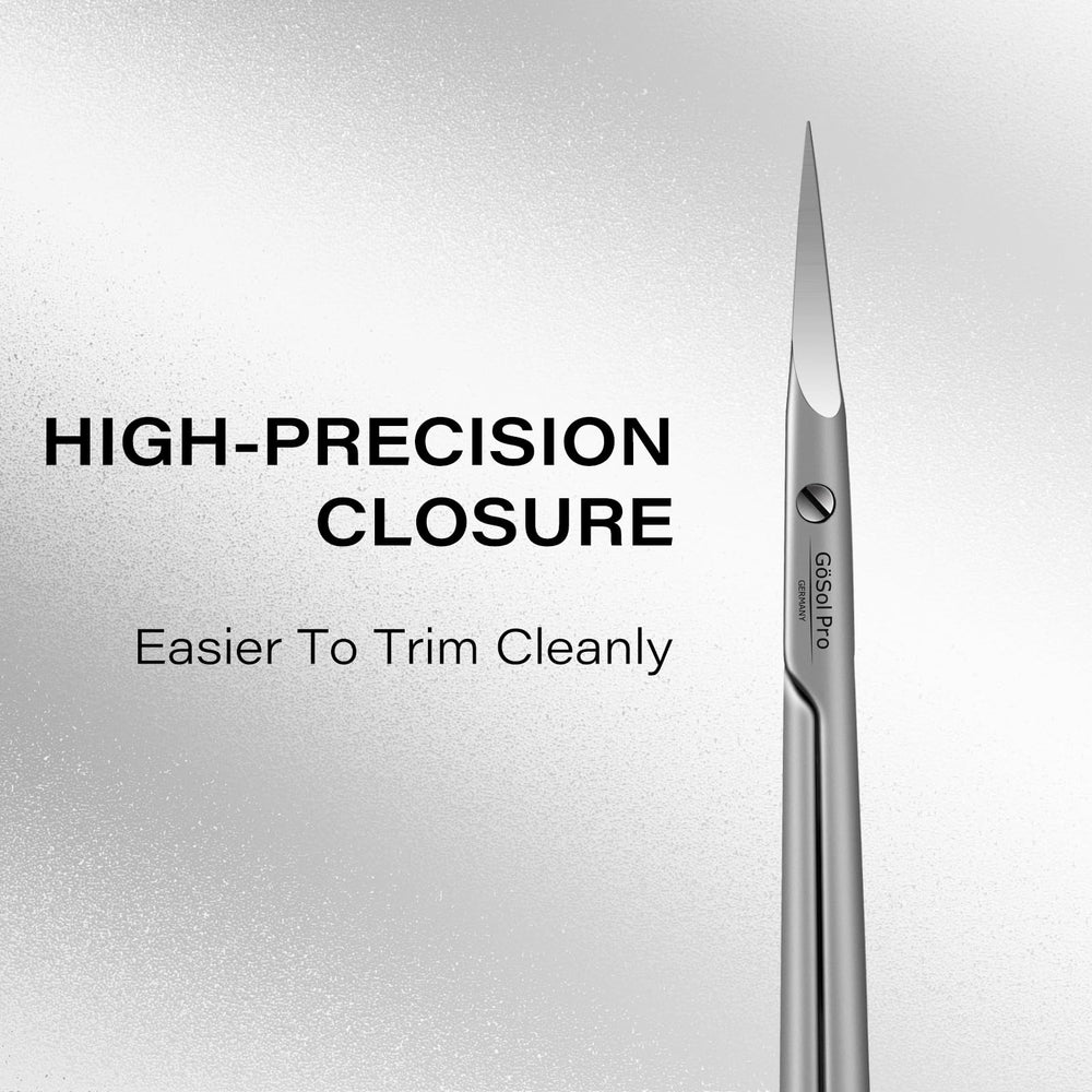 GÖSOL scissors held in hand showing scale and comfortable control for detailed work