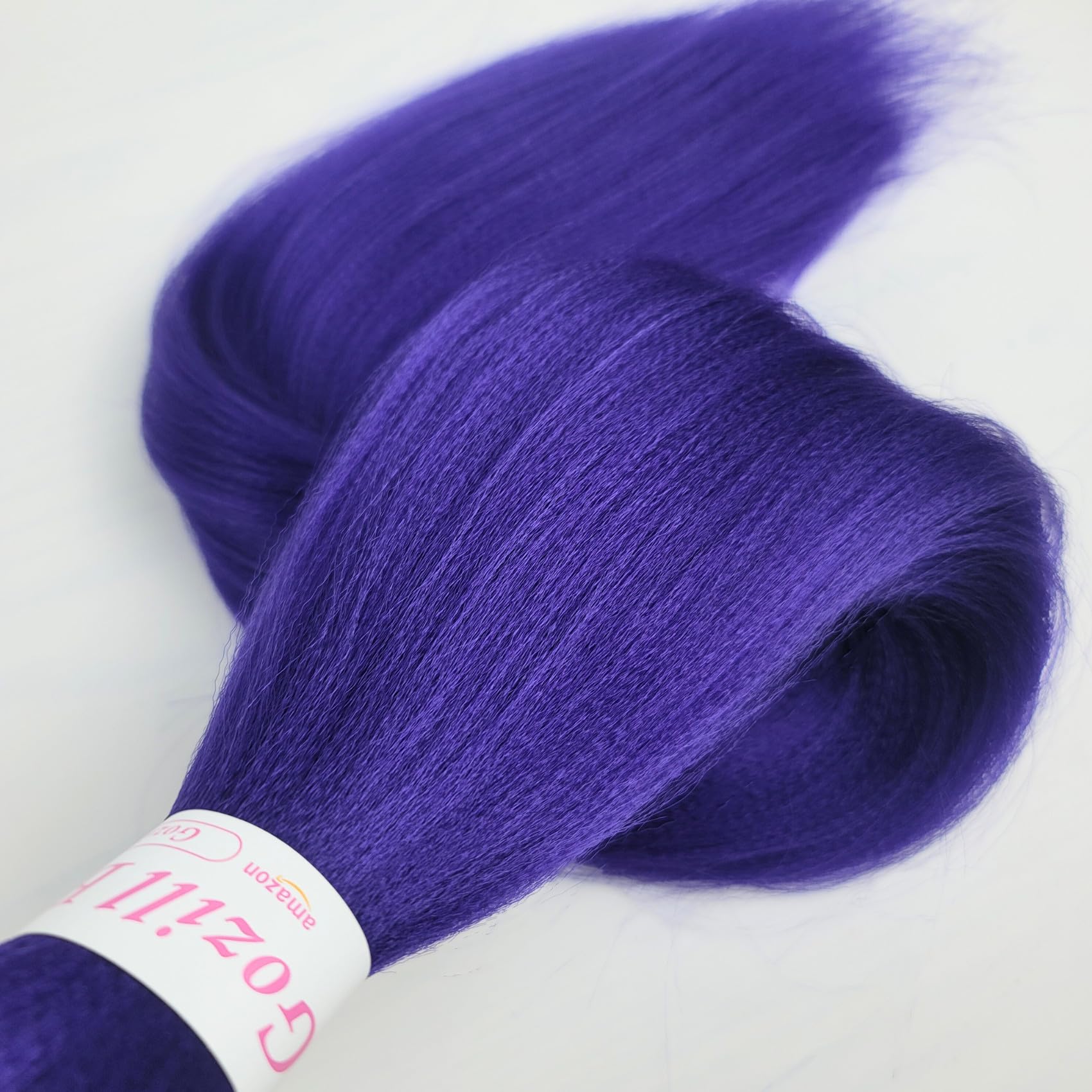 Gozill hair beside a ruler showing length scale and easy-to-handle weight benefit