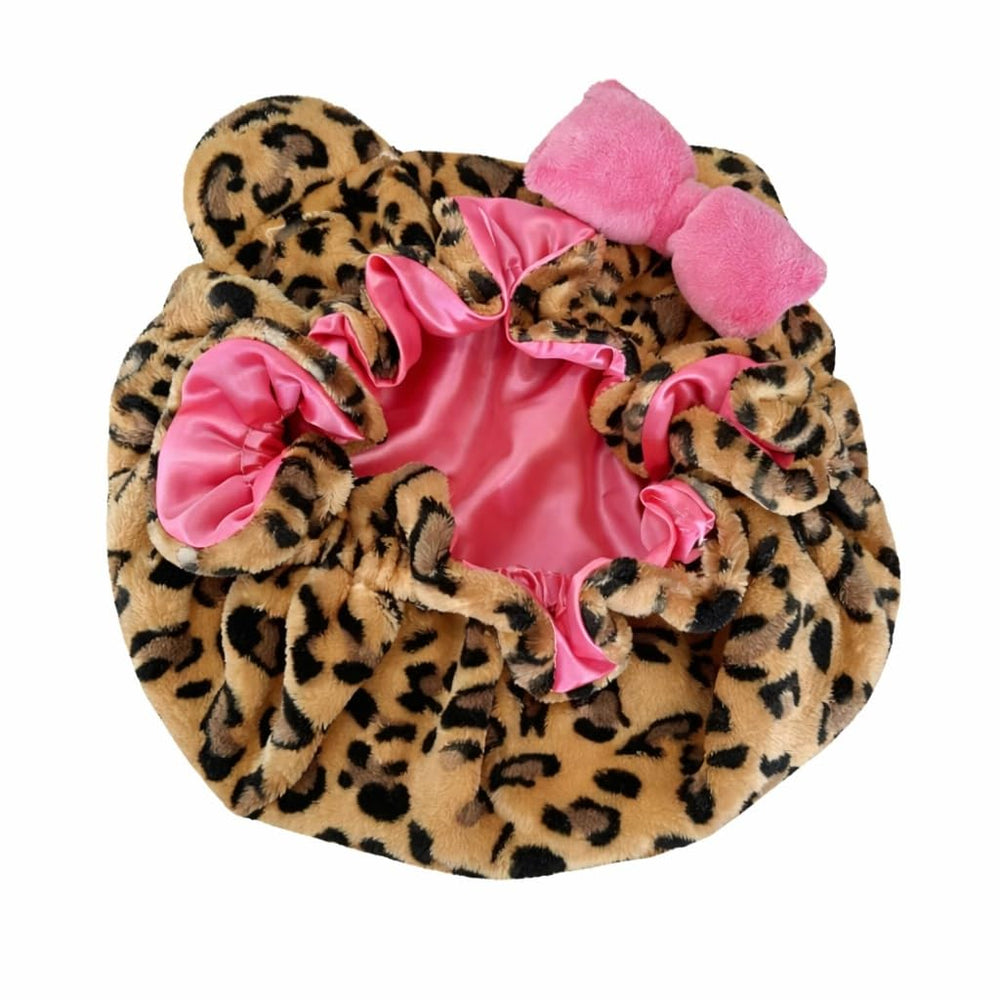 Grabitly bonnet worn by model side-sleeping demonstrating stay-in-place benefit