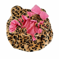 Grabitly bonnet worn by model side-sleeping demonstrating stay-in-place benefit