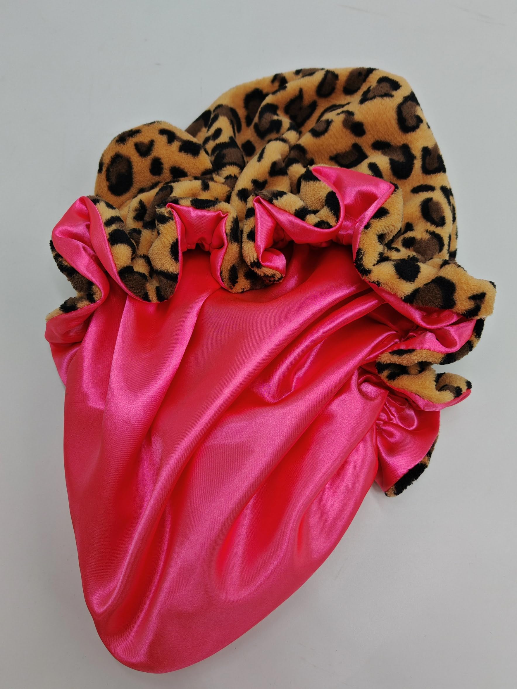 Grabitly bonnet held in hand to show roomy size for long or thick hair