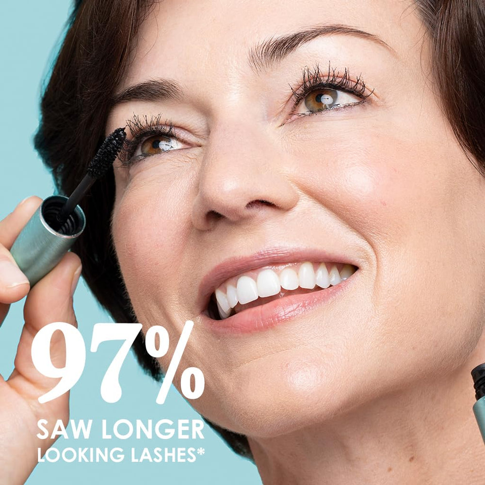 Grande Cosmetics mascara tube in hand to show true compact size and portability