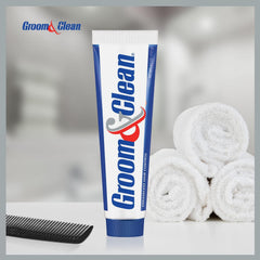 Groom & Clean texture close-up on fingertip showing greaseless creamy formula