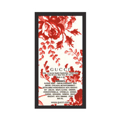 Gucci Bloom 30ml bottle beside a coin for scale and portability