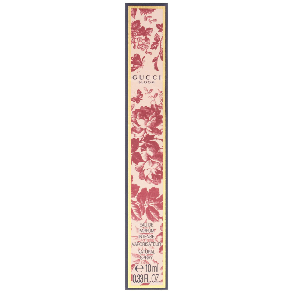 Gucci Bloom Intense styled with white flowers suggesting rich floral aroma experience