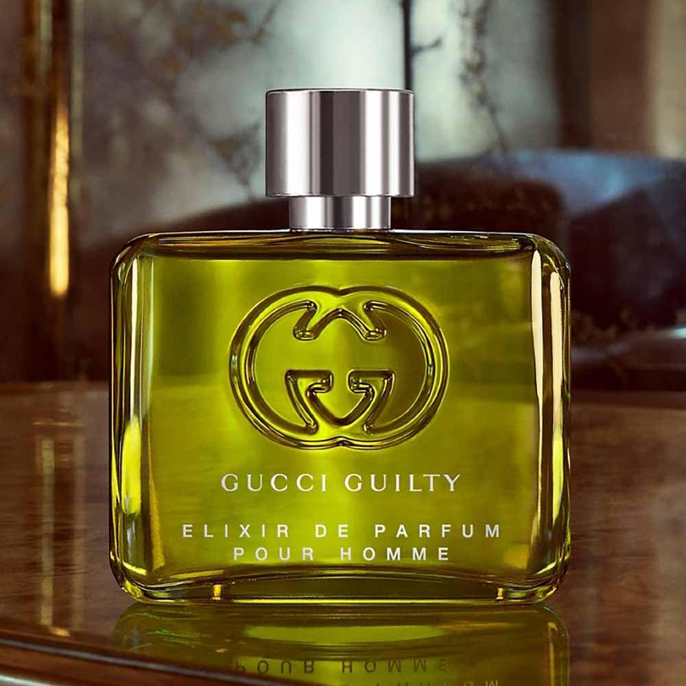 Gucci Guilty next to watch to show 2.0 oz scale, brand fits travel essentials