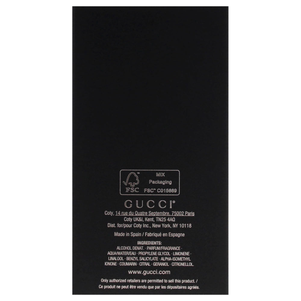 Gucci 3 oz bottle next to everyday objects for size comparison