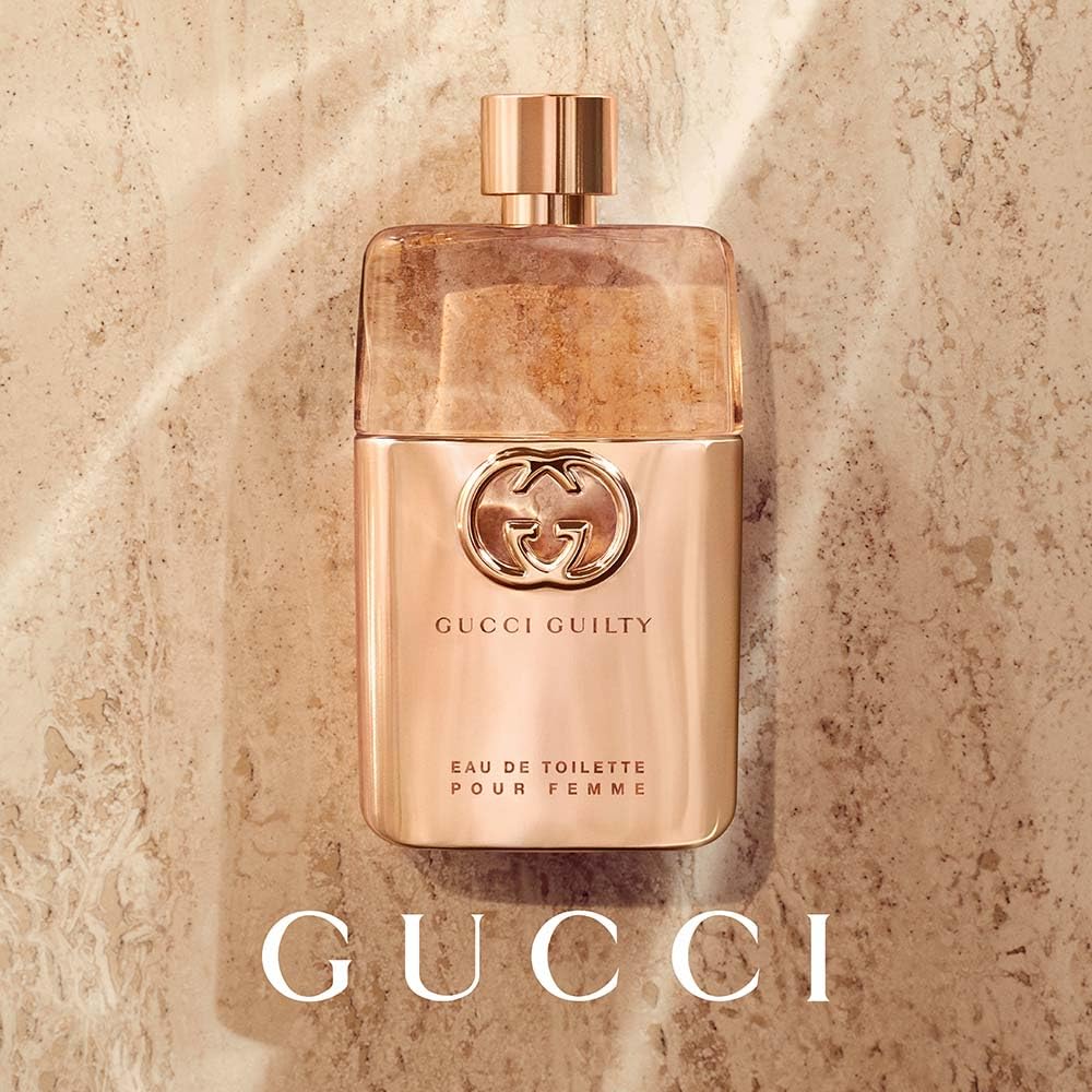 Gucci Guilty being sprayed on wrist demonstrating easy application and lasting scent