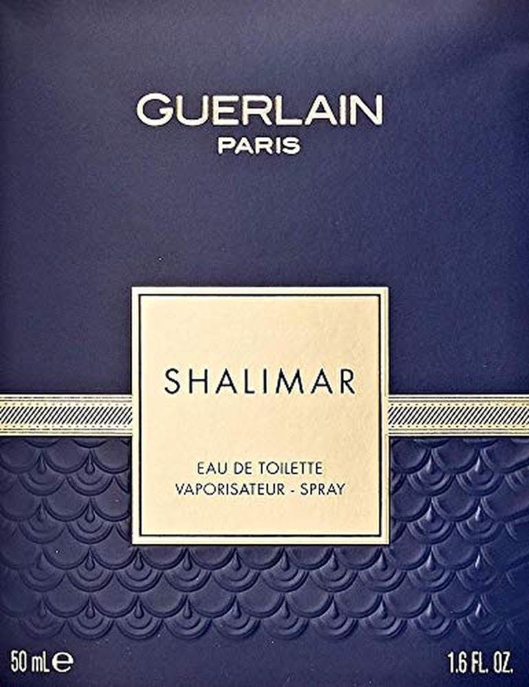 Guerlain Shalimar held in hand to show 1.6 oz size and travel convenience